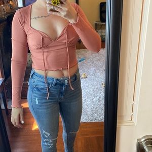Long sleeve, salmon color crop top from Dolls Kill. Size medium (runs tight).